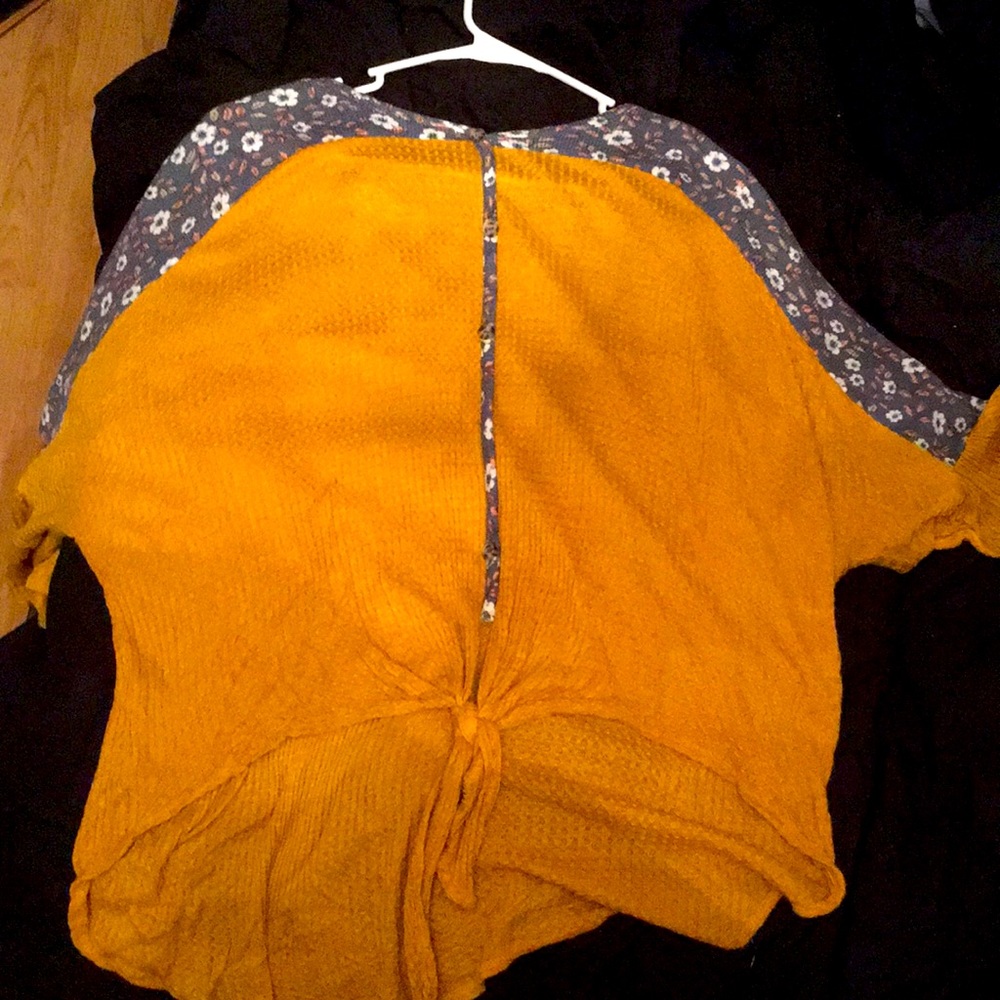 Yellow loose top with florals.